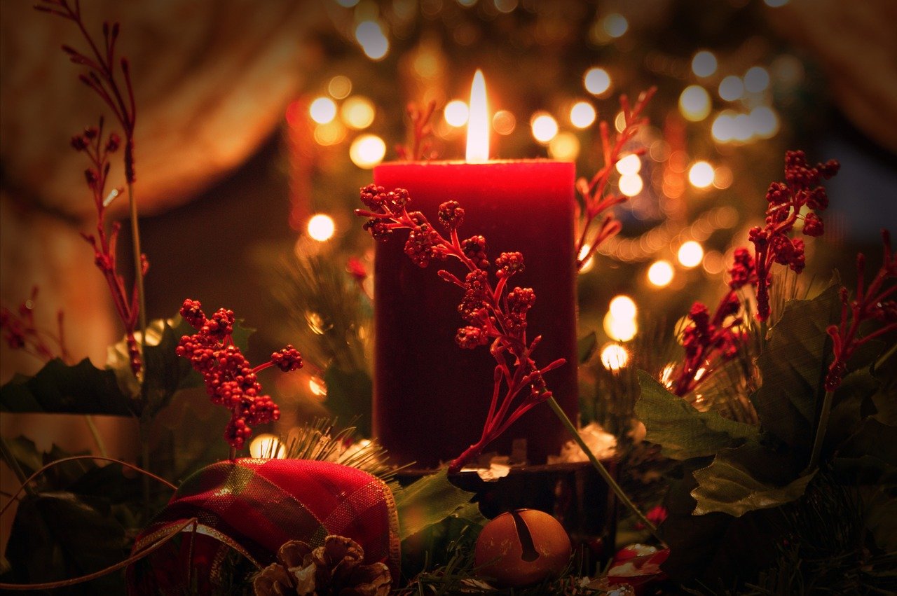 Candle being lit for the holidays that can be hazardous to your health